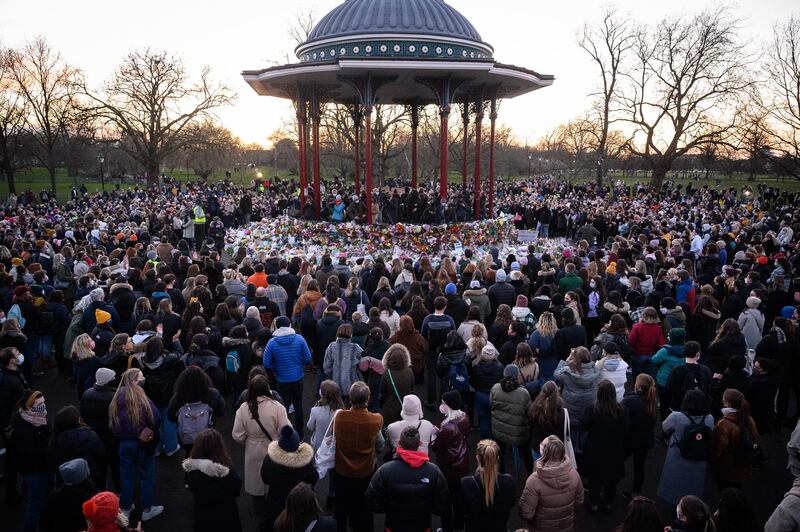 People gather to lay flowers and pay their respects to Sarah Everard, at Clapham Common bandstand, London. Getty Images