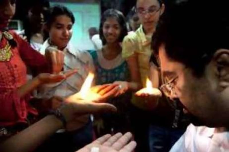 New Delhi, India, 21/05/10. Sanal Edamaruku, President of Rationalist International demonstrates to schoolchildren some of the tricks used by religious men in India to trick the faithful into believing they are divine. Mr. Edamaruku shows of the sleight of hand into such things as levitation, burning palms and how some Sadhus produce 'Holy Ash' from the palms of their hands. Education of children ,he hopes, will go a long way to spreading the message that paying for these 'Godmen' to perform rituals is nothing more than a con. pic Graham Crouch for The National.    For Hannah Gardner story