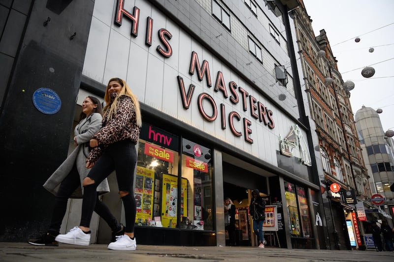 Shoppers pass by the original branch of the HMV chain of music retailers in London, England. Getty Images