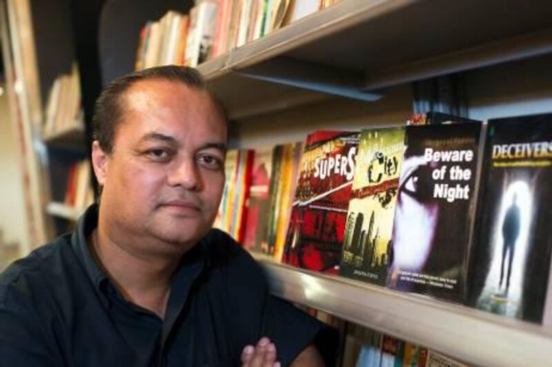 Joygopal Podder admits that he visits bookstores to see his work on display. Simon De Trey-White for The National.