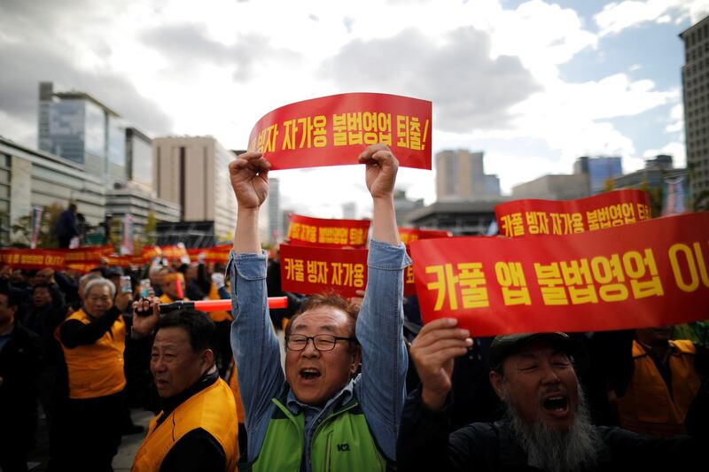 Taxi drivers take part in a protest against a carpool service application that will be launched by Kakao Corp later this year, in central Seoul, South Korea. Reuters