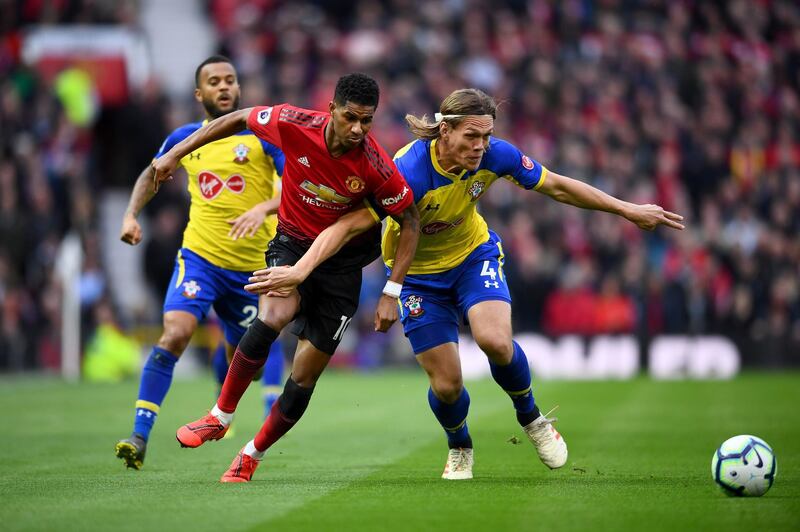 Rashford of Manchester United is challenged by Vestergaard. Getty Images