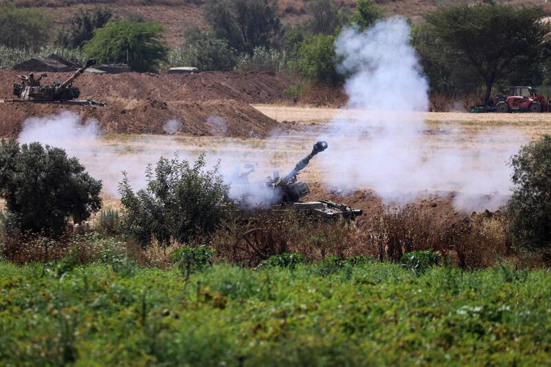 Israeli army tanks fire shells from a position by the border into the Gaza Strip. AFP