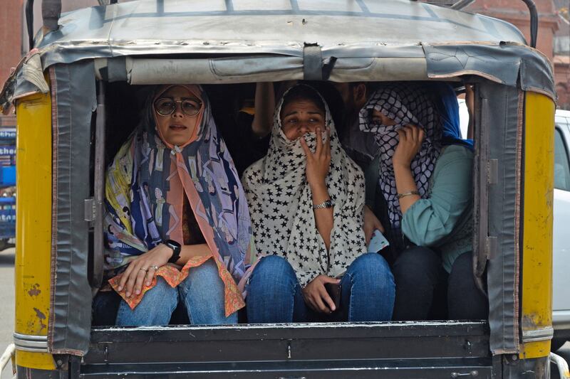 Women ride a motorised rickshaw in Amritsar. AFP