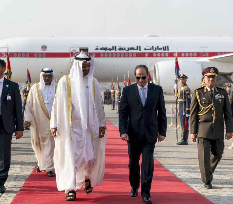 CAIRO, EGYPT - April 10, 2018: HH Sheikh Mohamed bin Zayed Al Nahyan Crown Prince of Abu Dhabi Deputy Supreme Commander of the UAE Armed Forces (2nd L), received by HE Abdel Fattah El Sisi, President of Egypt (3rd L), upon arrival at Cairo international Airport, commencing an official visit. Seen with HE Juma Al Junaibi, UAE Ambassador to Egypt (L).

( Rashed Al Mansoori / Crown Prince Court - Abu Dhabi )