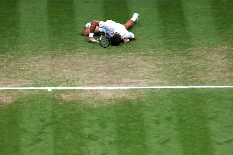 Novak Djokovic of Serbia falls. Getty