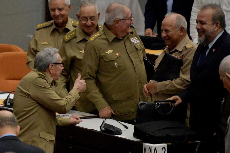 In this photo taken on December 21, 2019, Cuban Communist Party leader, Raul Castro, left, gives the thumbs-up to newly appointed Prime Minister Manuel Marrero Cruz, right. Cuba's ruling Communist Party will hold a congress from April 16 to 19, at the end of which Miguel Diaz-Canel will become its leader, replacing Mr Castro who is retiring. AFP