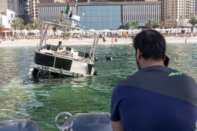 DUBAI, UNITED ARAB EMIRATES.  08 JANUARY 2019. A sunken yacht being salvaged by it’s owner Mohamed Irfan and some volunteer divers off the beach on JBR. (Photo: Antonie Robertson/The National) Journalist: None. Section: National.