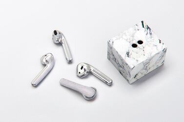 The fully functional diamond-encrusted Apple AirPods come with their own marble stand. Courtesy Ian Delucca