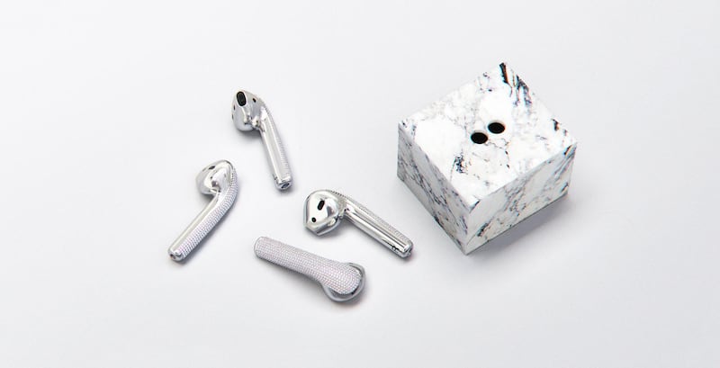The fully functional diamond-encrusted Apple AirPods come with their own marble stand. Courtesy Ian Delucca