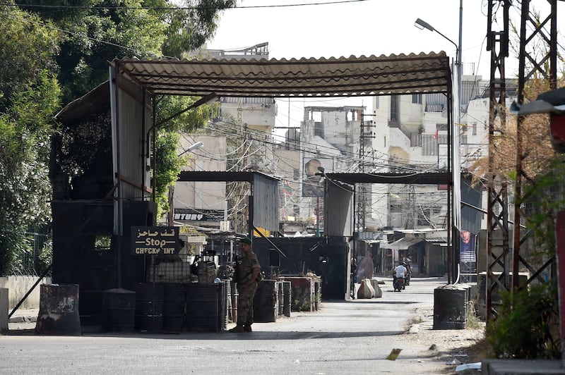 Lebanese army soldiers stand guard at the entrance of Ain Al Hilweh Palestinian refugee camp. EPA