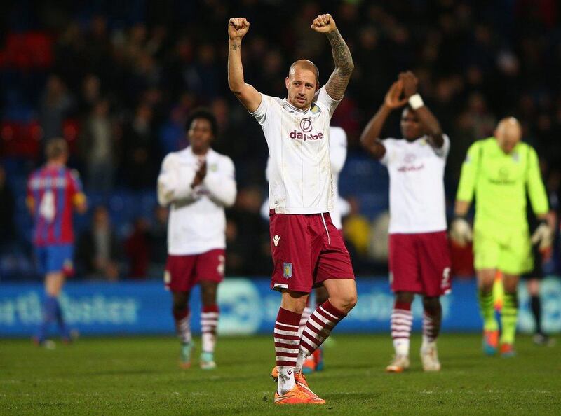 Alan Hutton of Aston Villa thanks his team's supporters following their 1-0 Premier League win over Crystal Palace at Selhurst Park on Tuesday. Ian Walton / Getty Images