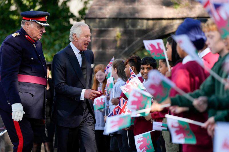 Britain's King Charles III speaks with members of the public as he leaves a service of prayer and reflection for the life of Queen Elizabeth II, at St Llandaff Cathedral in Cardiff. AFP