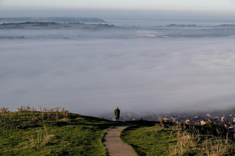 Early morning mist lingers below Glastonbury Tor as the sun rises over Somerset in the UK. Matt Cardy/Getty Images