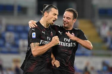 C Milan's Zlatan Ibrahimovic celebrates scoring the second goal from the penalty spot with Giacomo Bonaventura. Reuters