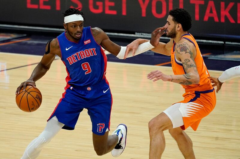 Abdel Nader  attempts to guard Detroit Pistons forward Jerami Grant. AP