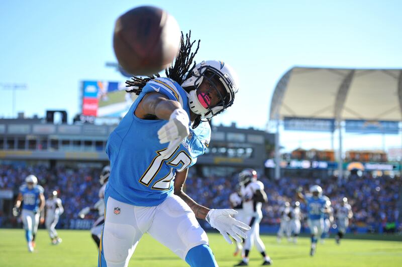 Los Angeles Chargers wide receiver Travis Benjamin throws the football after scoring a touchdown during the second half against the Denver Broncos at StubHub Center. Orlando Ramirez / USA TODAY Sports