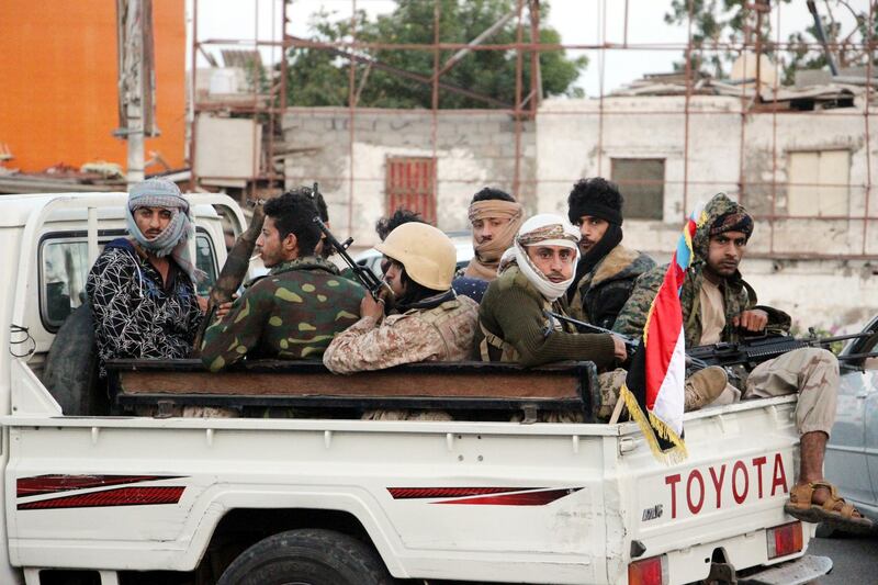 epa06481828 Armed supporters of the separatist Southern Movement patrol a street following clashes in the southern port city of Aden, Yemen, 28 January 2018. According to reports, southern separatists in Yemen have seized government buildings in the city of Aden in clashes with forces of Yemeni President Abdo Rabbo Mansour Mansour Hadi.  EPA/STR