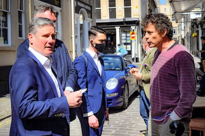 PA via Reuters
Labour leader Sir Keir Starmer (left) listens to Rod Humphris (right), landlord of The Raven pub in Bath, as he shouts how disappointed he is with him and the Labour party during the pandemic, consequently asking him to leave and banning him from the pub,. Mr Starmer was visiting the city to support West of England metro mayoral candidate Dan Norris and mark Labour's launch of an independent Commission to rebuild Britain's high streets. Picture date: Monday April 19, 2021.No Use UK. No Use Ireland. No Use Belgium. No Use France. No Use Germany. No Use Japan. No Use China. No Use Norway. No Use Sweden. No Use Denmark. No Use Holland. No Use Australia.