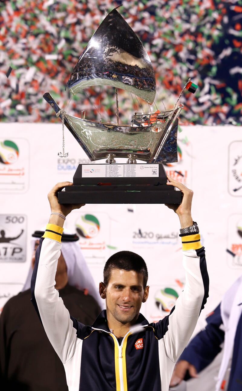 Novak Djokovic of Serbia with the trophy after winning the Dubai Duty Free Tennis Championships in Dubai, United Arab Emirates, Saturday, March 2, 2013. (AP Photo/Regi Varghese) *** Local Caption ***  Mideast Emirates Dubai Tennis Championships.JPEG-0c9a2.jpg