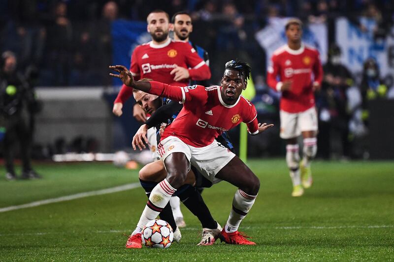 Manchester United midfielder Paul Pogba under pressure from Atalanta's Teun Koopmeiners. AFP