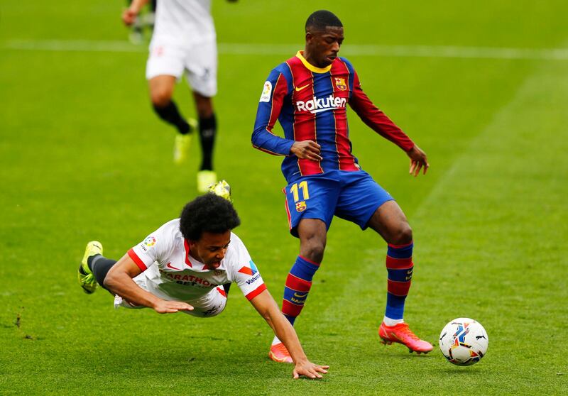 Barcelona attacker Ousmane Dembele and Sevilla's Jules Kounde. Reuters