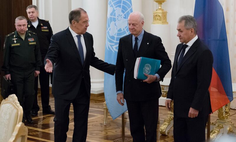 Russian Foreign Minister Sergey Lavrov, center left, and Russian Defence Minister Sergei Shoigu, right, welcome UN Special Envoy for Syria Staffan de Mistura, center, prior to their talks in Moscow, Russia, Thursday, Dec. 21, 2017. (AP Photo/Ivan Sekretarev)