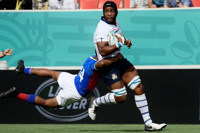 File photo of Namibia's wing Chad Plato, left, tackling Italy's flanker Maxime Mbanda during the Japan 2019 Rugby World Cup. AFP