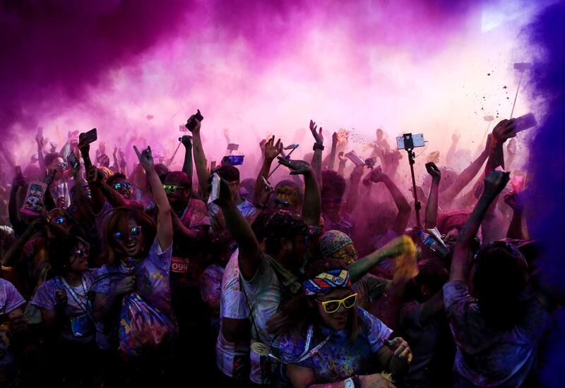 Coloured powder is sprayed on runners as they celebrate during a 'Color Fun Run' in Pasay city, Metro Manila, Philippines. Romeo Ranoco / Reuters