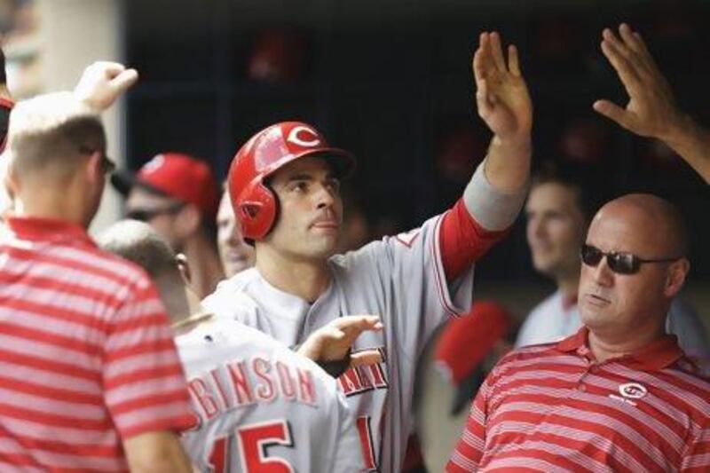 Joey Votto, centre, of the Cincinnati Reds, is deserving of the votes he has received by the fans to start Major League Baseball's All-Star Game.