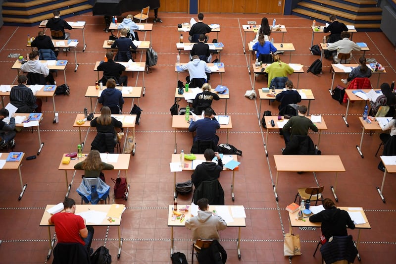 Students attend a secondary school exam, at the auditorium of Paul Natorp Gymnasium, under restrictions imposed due to Covid-19, in Berlin, Germany. Reuters