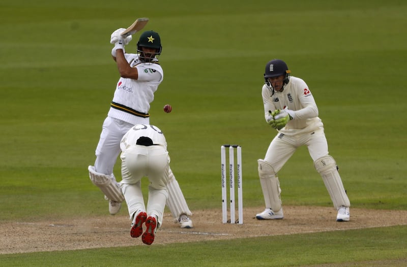 Pakistan's Shan Masood lets fly and has an England fielder ducking for cover. PA