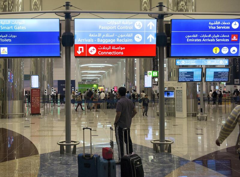 Airline travelers wait to clear immigration control at the Dubai International Airport in the United Arab Emirates on August 25, 2016. (Photo by Robert Nickelsberg/Getty Images)