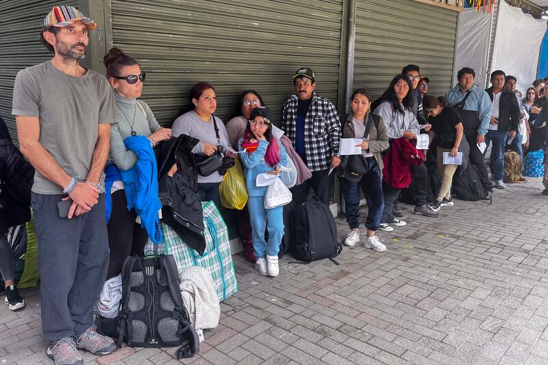 Tourists wait outside the Machu Picchu train station. AFP