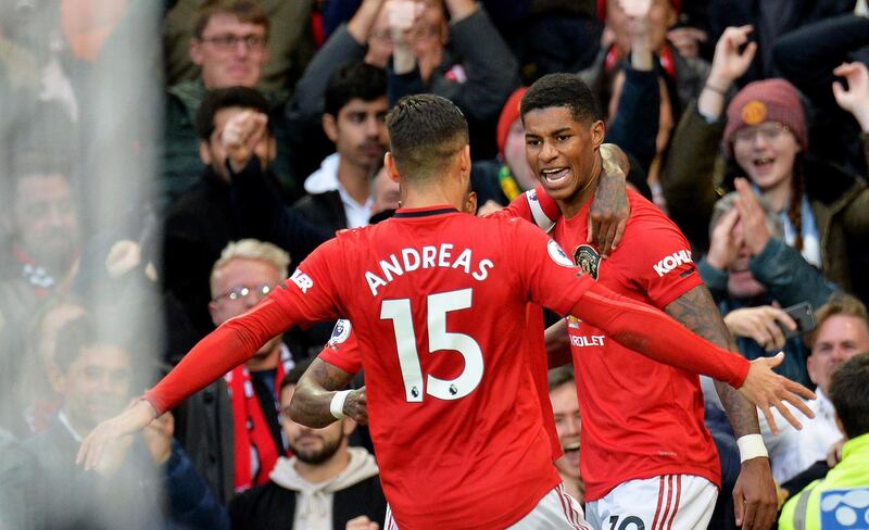 Manchester United's Marcus Rashford celebrates with teammates. EPA