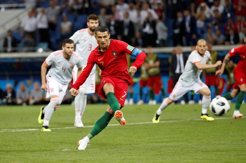 Portugal's Cristiano Ronaldo scores their first goal from the penalty spot. Francois Lenoir / Reuters