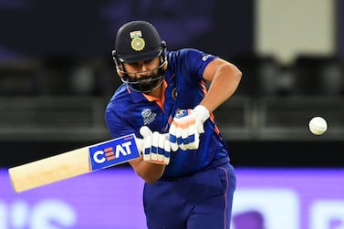 (FILES) In this file photo taken on November 8, 2021 India's Rohit Sharma plays a shot during the ICC men’s Twenty20 World Cup cricket match between India and Namibia at the Dubai International Cricket Stadium in Dubai.  - Rohit Sharma has been named the new captain of India's T20 side, replacing Virat Kohli, the cricket board said on November 9 after the side were dumped out of the T20 World Cup.  (Photo by Aamir QURESHI  /  AFP)
