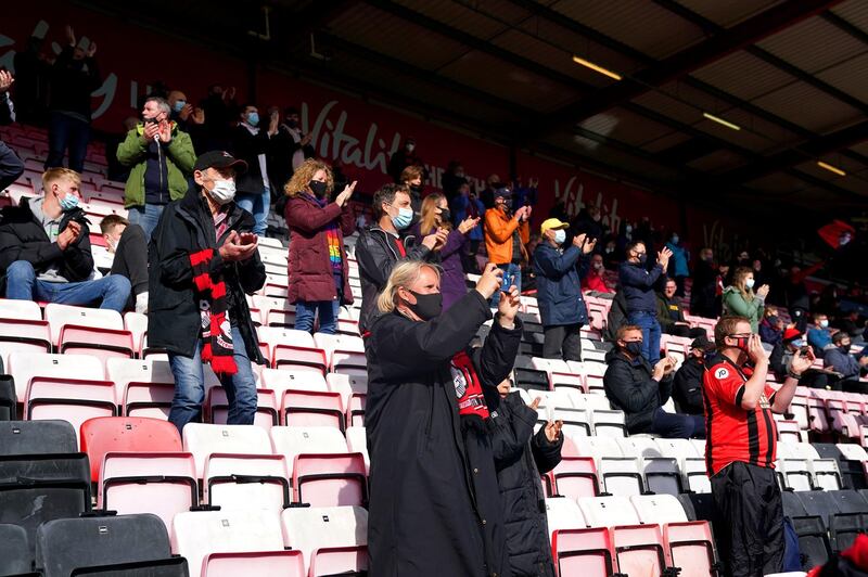 AFC Bournemouth fans applaud their team at the Vitality Stadium on Monday. PA