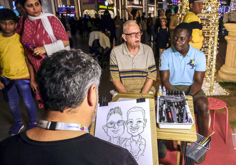 Abu Dhabi, United Arab Emirates, January 5, 2020.  
--  A caricature artist at the global Village.
Photo essay of Global Village.
Victor Besa / The National
Section:  WK
Reporter:  Katy Gillett