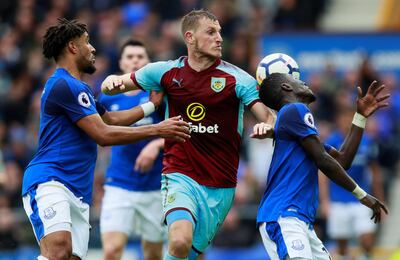 Soccer Football - Premier League - Everton vs Burnley - Goodison Park, Liverpool, Britain - October 1, 2017   Burnley’s Chris Wood in action with Everton's Ashley Williams and Idrissa Gueye    Action Images via Reuters/Jason Cairnduff  EDITORIAL USE ONLY. No use with unauthorized audio, video, data, fixture lists, club/league logos or "live" services. Online in-match use limited to 75 images, no video emulation. No use in betting, games or single club/league/player publications. Please contact your account representative for further details.