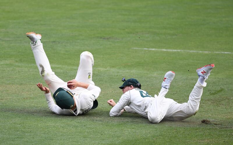 Australia's Marnus Labuschagne (left) takes a catch off Pakistan batsman Mohammad Rizwan. AFP