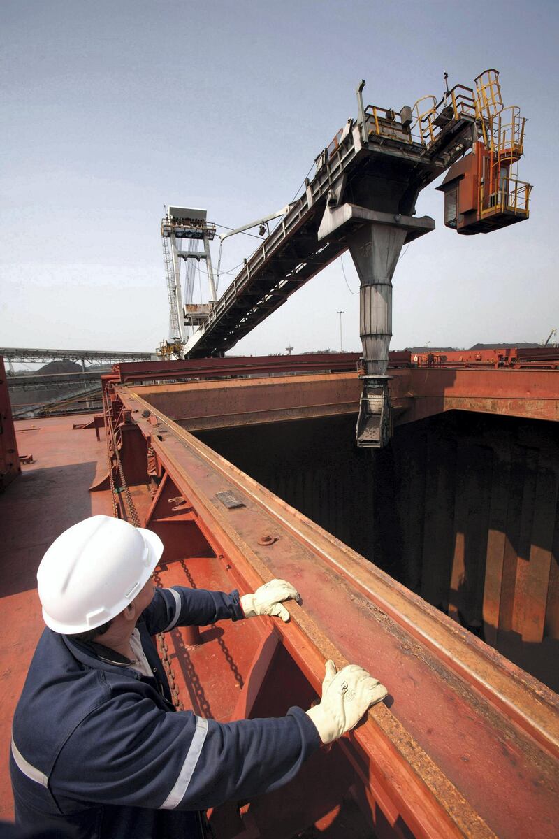 A supervisor observes ship loading machinery preparing to load coal into a freighter at the Richard's Bay coal terminal, in Richard's Bay, South Africa, on Tuesday, Sept. 21, 2010. South Africa's Richards Bay Coal Terminal, Africa's largest coal-export facility, shipped about 61.14 million metric tons of the fuel last year, mainly to Europe. Photographer: Nadine Hutton/Bloomberg