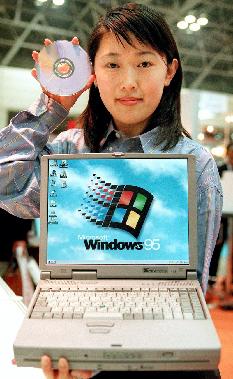 A campaign girl shows off new portable computer "DynaBook TECRA780 DVD/8.1" of Japan's all-round electoric machinery maker Toshiba Corp. at its booth at a computer exhibition in Chiba 06 April. The new computer is equipped with Intel's new 266MHz Mobile Pentium II processor and a DVD-ROM drive. The firm started selling from 02 April, priced at 788,000 yen in Japan and at 5,899 dollars in USA.       AFP PHOTO (Photo by TORU YAMANAKA / AFP)