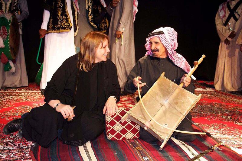 Author Lisa Urkevich, above left, with a traditional musician in Hail, a city in north-west Saudi Arabia. Courtesy Lisa Urkevich