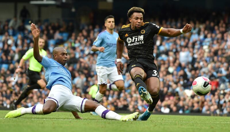 Wolverhampton Wanderers' Adama Traore, right, scores his second goal during the English Premier League soccer match between Manchester City and Wolverhampton Wanderers at Etihad stadium in Manchester, England, Sunday, Oct. 6, 2019. (AP Photo/Rui Vieira)