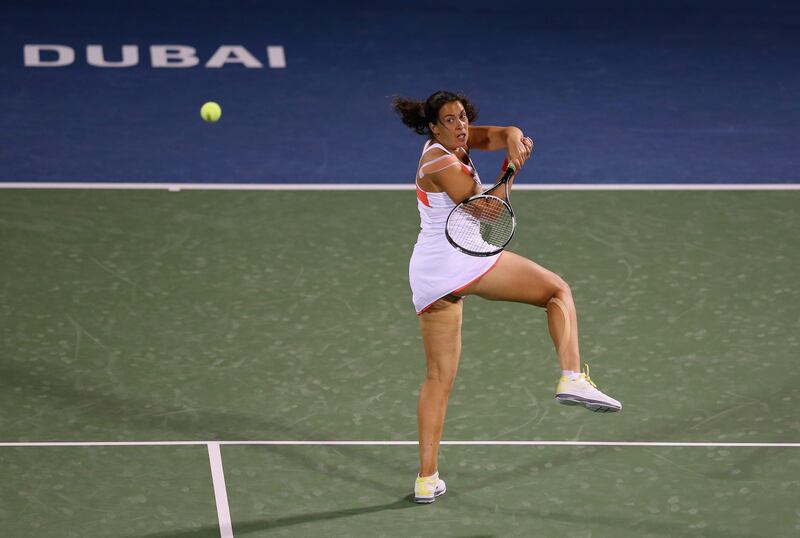 DUBAI, UNITED ARAB EMIRATES - FEBRUARY 21:  Marion Bartoli of France in action against Caroline Wozniacki of Denmark during day four of the WTA Dubai Duty Free Tennis Championship on February 21, 2013 in Dubai, United Arab Emirates.  (Photo by Julian Finney/Getty Images) *** Local Caption ***  162256696.jpg