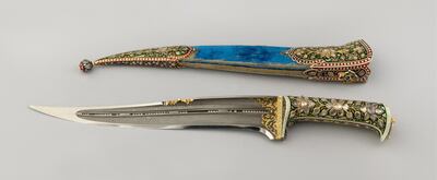 Ornamented dagger and scabbard, presented by the Maharaja of Alwar. Featuring an enamelled and bejewelled handle and a scabbard, the blade is filled with loose seed pearls.
<br/>
<br/>For single use only in relation to: Splendours of the Subcontinent: A Prince's Tour of India 1875-6. Not to be archived or sold on.
<br/>
<br/>Credit line: Royal Collection Trust / vÉ¬É?vÉ¬ÇvÇ¬© Her Majesty Queen Elizabeth II 2017
<br/>
<br/>