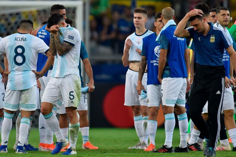 Argentina' manager Lionel Scaloni and players at the end of the match. AFP