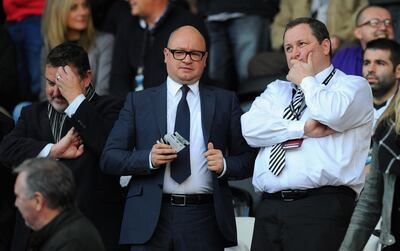 FILE: Premier League club Newcastle United have been put up for sale by owner Mike Ashley SWANSEA, WALES - OCTOBER 04:  Newcastle United owner Mike Ashley (r) chats with managing director Lee Charnley before the Barclays Premier League match between Swansea City and Newcastle United at Liberty Stadium on October 4, 2014 in Swansea, Wales.  (Photo by Stu Forster/Getty Images)