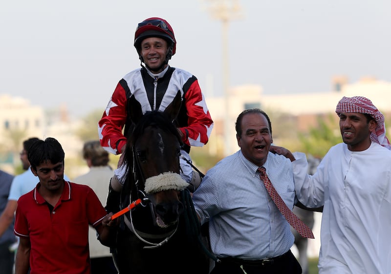 Abu Dhabi, United Arab Emirates- March,09, 2014: Jockey Royston Ffrench riding Ubu Al Mels wins the Race2 at the Abudhbai Equestrian Club in Abudhabi . ( Satish Kumar / The National )  For Sports